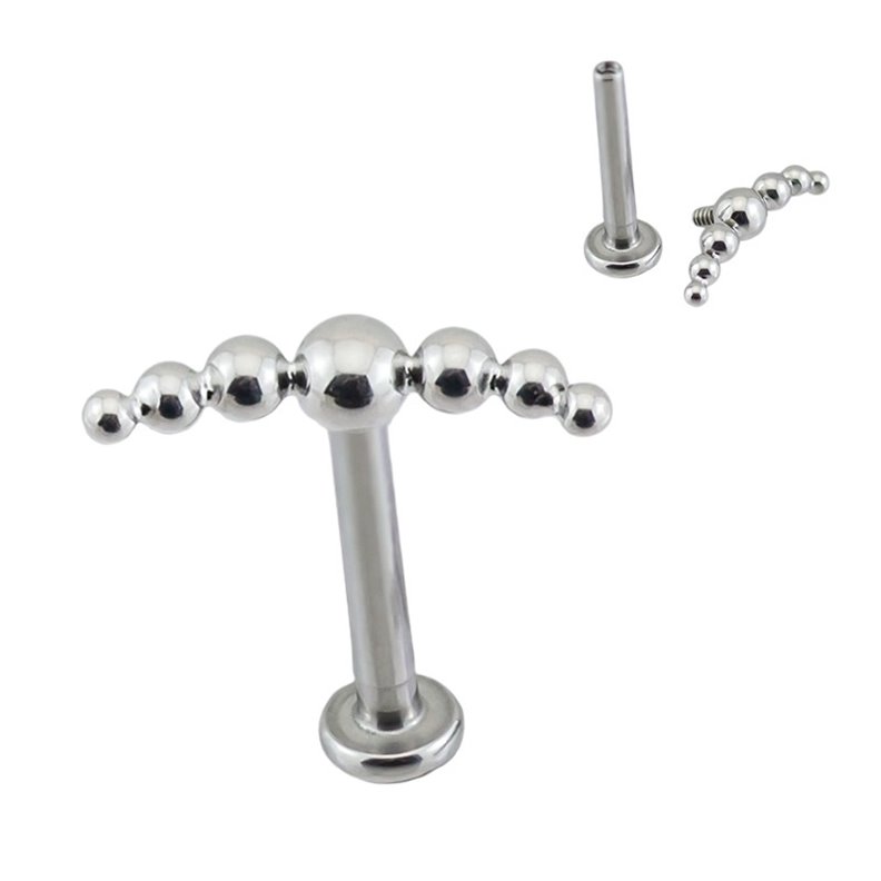 Labret piercing with 7 asymmetrical Titanium balls